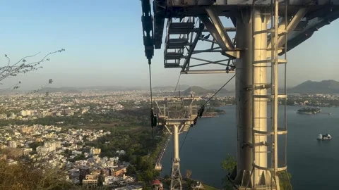 Ropeway cable car descending towards lake pichola in Udaipur Stock-Footage 336067496