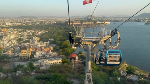Ropeway cable car descending towards lake pichola in Udaipur Stock Footage 336067525