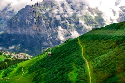 Ropeway in the swiss alps. View from the cable car. Фото