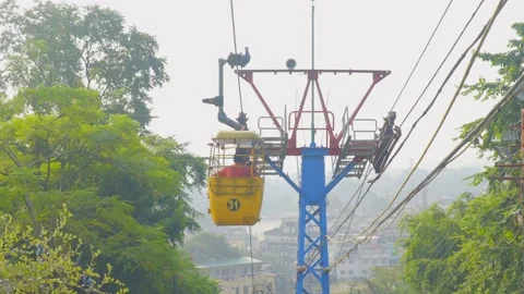 The ropeway used to ferry devotees to the Mansa Devi temple Stock Footage 221737746