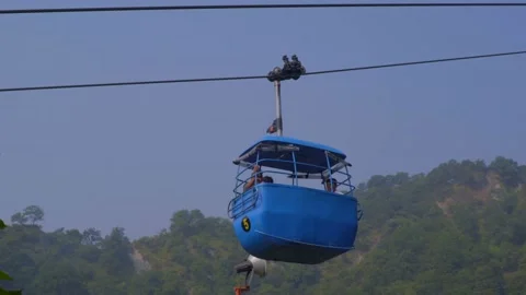 Ropeways moving in mansa devi temple in haridwar Stock Footage 221737695