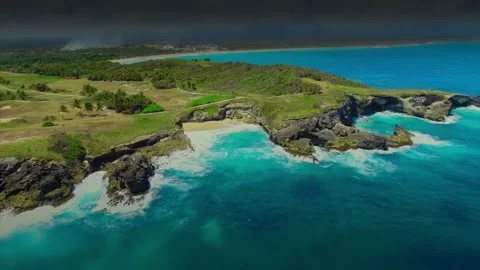 Ropical landscape. View of ocean blue waves break on cliff of a rocky mountain. Stock Footage 166495671