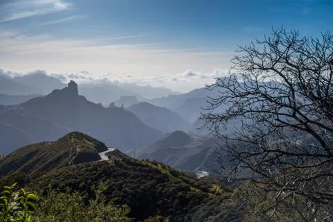 Roque Nublo mountain with clouds Stock Photos