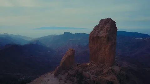 Roque Nublo mountain in Gran Canaria, Canary Islands on a blue day. Cinematic Stock Footage 228618663
