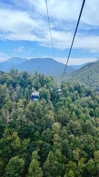 Rosa Khutor cable car over mountain forest in Sochi Stock Photos
