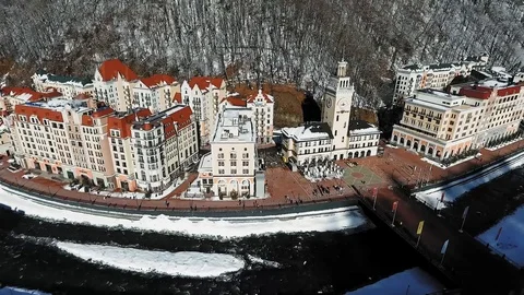 Rosa Khutor Sochi. Ski resort. Town hall square. Snow in mountains. 스톡 동영상 100160339