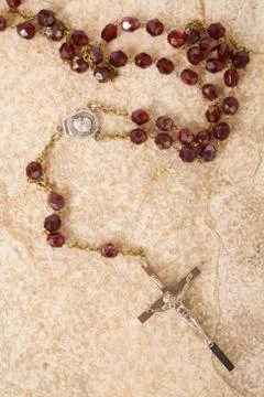 Rosary beads on textured background Stock Photos