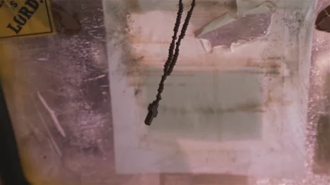 Rosary Lightly Bouncing in Moving Vehicle Stock Footage 139791364