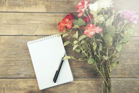 Rose and notepad Stock Photos