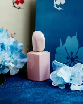 Rose bottle of parfum on the table Stock Photos