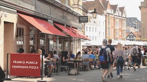 Rose Crescent restaurants with diners and view to main market square, Cambridge Stock Footage 92845616
