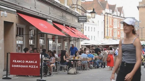Rose Crescent restaurants with diners and view to main market square, Cambridge Stock Footage 92845805