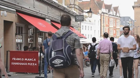 Rose Crescent restaurants with diners and view to main market square, Cambridge Stock Footage 92845882