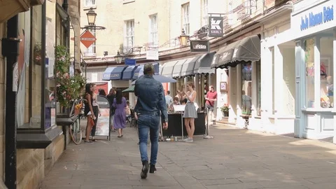 Rose Crescent restaurants with diners and view of shops, Cambridge, UK Stock Footage 92846282