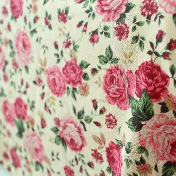 Rose design seamless pattern on fabric background Stock Photos