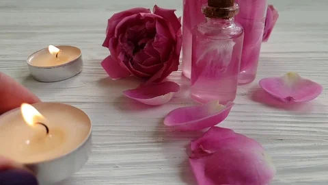 Rose extract candle slow motion Stock Footage 96094265