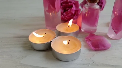 Rose extract, candle, slow motion Stock Footage 96094606
