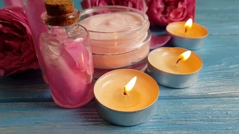 Rose extract, candle, slow motion cosmetic cream Stock Footage 96095401