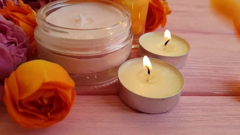 Rose extract, candle, slow motion cream cosmetic Stock Footage 96096706