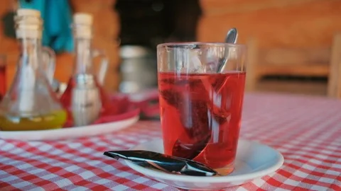 Rose fruit tea brewed with hot water in a glass cup Stock Footage 88613475