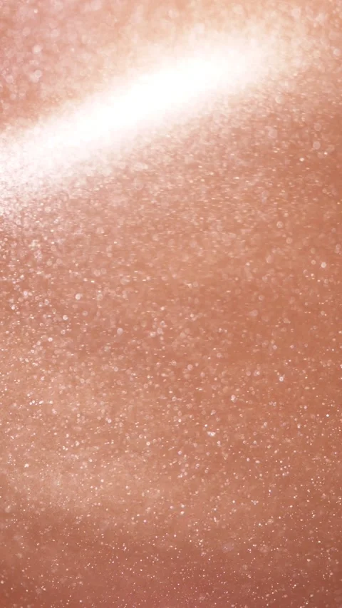 Rose gold particles swirling, generating luminous shimmer with elegant movement Stock Footage 343938626