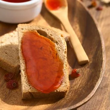Rose Hip Jam on Bread Stock Photos