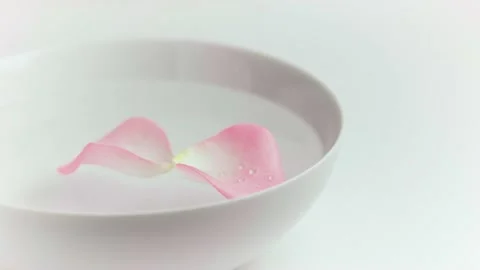 Rose petals floating in bowl Stock Footage 132274553