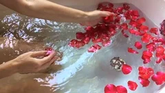 Woman Hand Preparing a Home Bath with Petals Dropping Red Rose Petals to  Water, Lifestyle Stock Footage ft. petals & red - Envato Elements