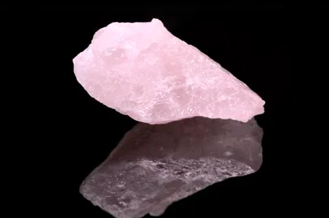 Rose Quartz on black background Stock Photos