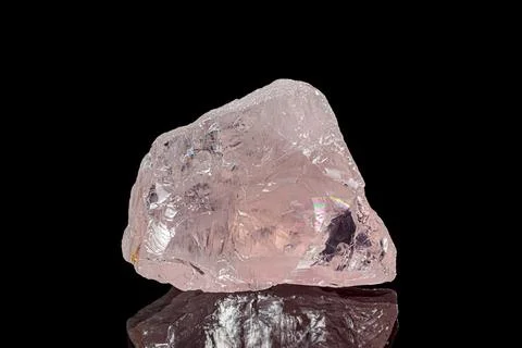 Rose quartz on dark background 库存照片