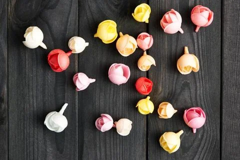 Rose shape sprinkle dots Sugar rose shape sprinkle dots on wooden backgrou... Stock Photos
