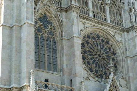 Rose window and neogothic arch detail of Votivkirche facade in Vienna Stock Photos
