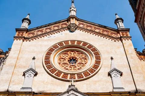 Rose window with floral patterns on the wall of an ancient church Rose win... Stock Photos