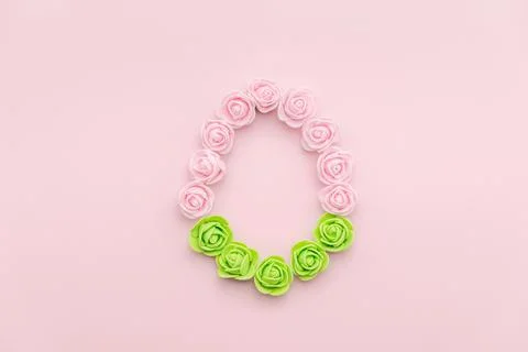 Rosebuds egg shape on pink background Stock Photos