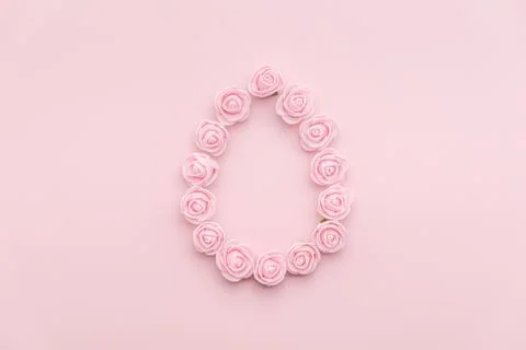Rosebuds egg shape on pink background Stock Photos