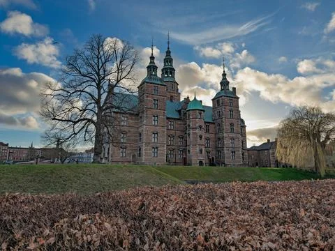 Rosenborg Castle view framed by beech hedge and spring clouds Photos