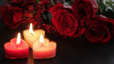 Roses and heart-shaped candles, roses in, Stock Video