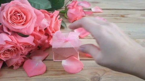 Roses bunch and gold ring with diamond and champagne glasses Stock Footage 101269182