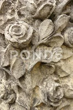 Roses carved in stone Stock Photos