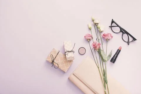 Roses with gift boxes lipstick table . High quality and resolution beautiful Stock Photos