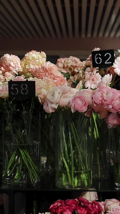 Roses, hydrangeas, chrysanthemums and other flowers in refrigerator room in a Stock Footage 273919360