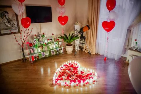 Roses in the light of the candle Stock Photos