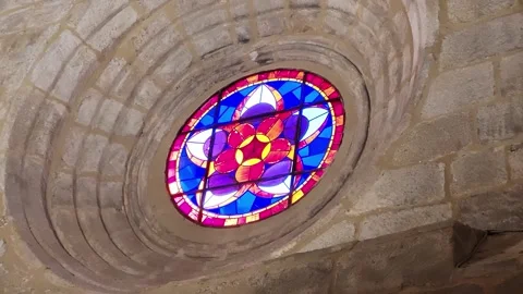 Rosette window. Stained glass windows with vibrant colors set in granite stone Stock Footage 327485464