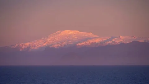 Rosy sunset on snowy mountain Stock Footage 73248917