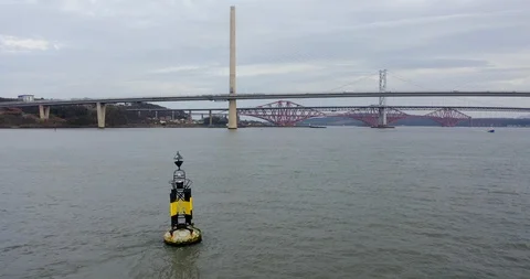 Rosyth East Cardinal Mark with Forth Bridges in Background Stock Footage 103468198