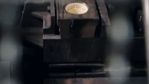 Rotary conveyor puts filled with dough waffle forms in oven Stock Footage 124608069