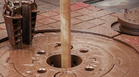 Rotary table while drilling oil well and pipe being rotated and a slip Stock Footage 54652652