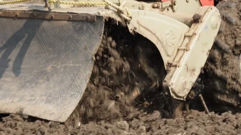 Rotary tiller in action Stock Footage 326306949