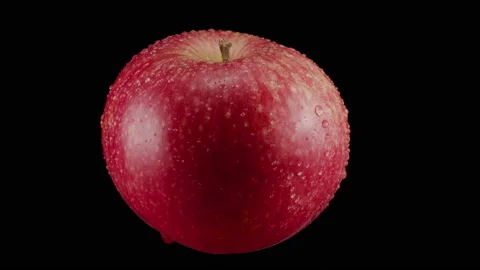 Rotate 360 degrees of a red ripe apple on a black background. Video stock 161749458