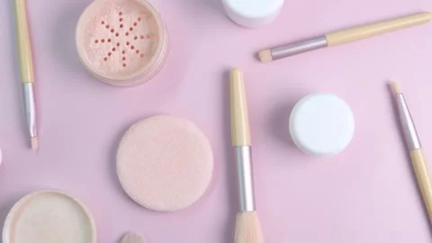 Rotate background with makeup brushes and eyeshadow palettes cream bottles on Stock Footage 246874875